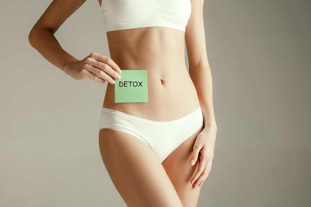 A woman in white underwear holding onto a green note